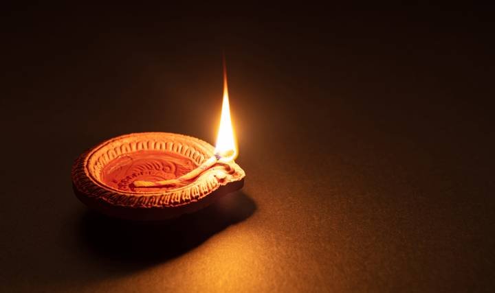 Diya signifying the Sarvesham Svastir Bhavatu Sloka